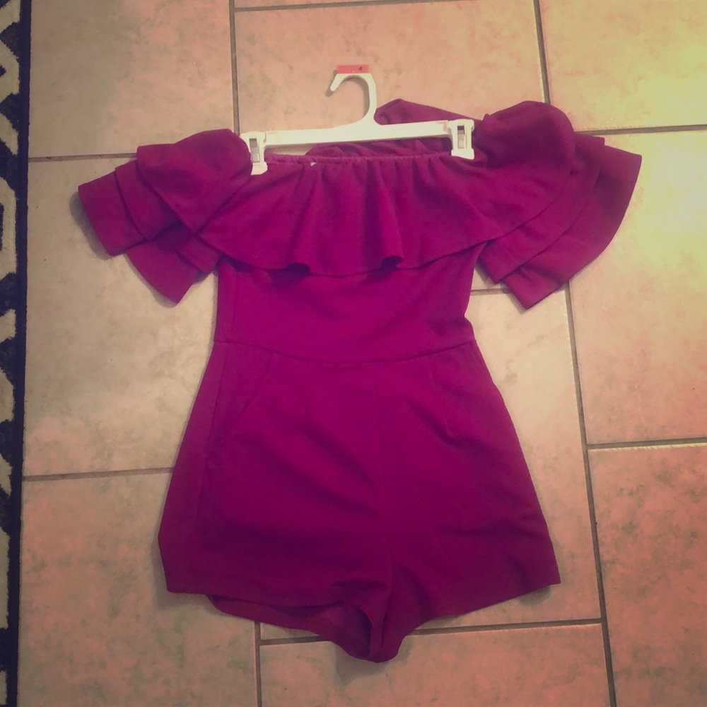 Purple off the shoulder ruffle romper.